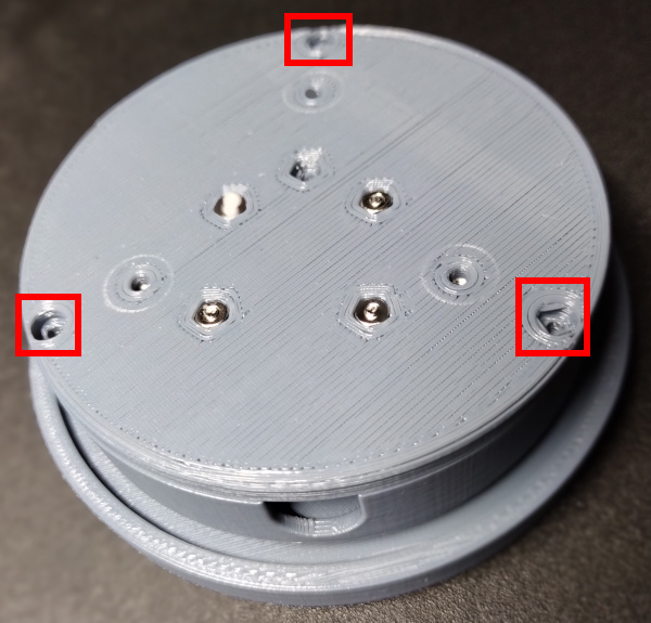 Bottom Placed on Assembled Body with Mounting Holes Highlighted